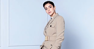 woman wearing grey trench coat