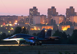 blue and white jet plane, aircraft, building, lights, Sukhoi Su-34