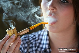 woman holding smoking pipe puffing smoke HD wallpaper