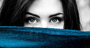 selective color photo of woman and blue textile