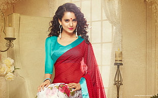 woman wearing red and teal sari dress