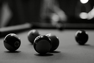 grayscale photo of billiard balls on pool table