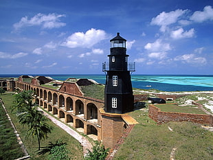 black lighthouse, fort, sea, beach, cannons