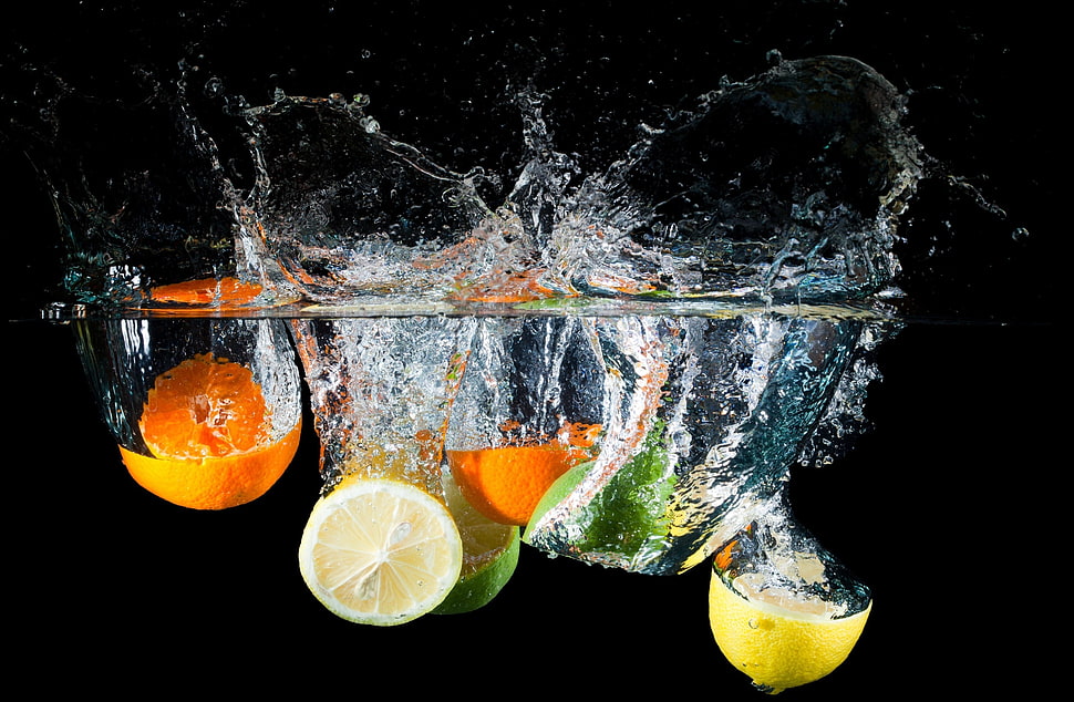 timelapse photography of sliced orange and lemon on water HD wallpaper