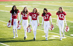 group of women wearing American football gears