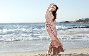 woman in peach halter-top dress on seashore HD wallpaper