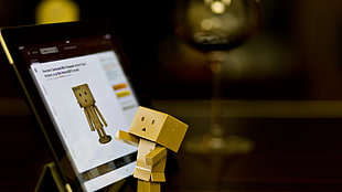 brown carton action figure, Danbo, technology, tablet , glass