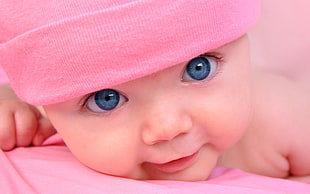 baby wearing pink beanie photo