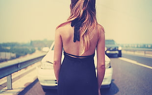 photo of woman's back while facing white car HD wallpaper