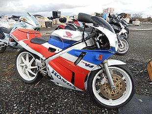 blue, white and red Honda sports bike near sports bikes HD wallpaper
