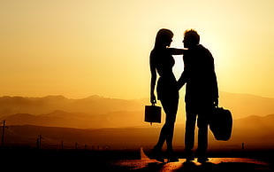 couple holding each other under sunset