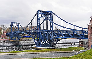 photo of blue suspension bridge