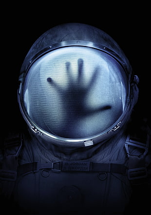 astronaut helmet with hand shadow digital wallpaper