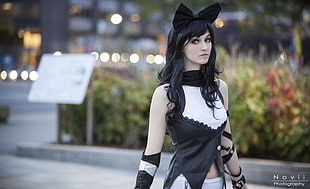 woman wearing white and black sleeveless cat costume in selective focus photography