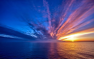 panoramic photo of ocean during golden hour HD wallpaper