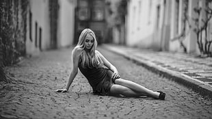 grayscale photo of woman sitting on concrete pavement, women, model, blonde, long hair HD wallpaper
