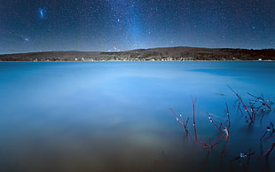 body of water during night time HD wallpaper