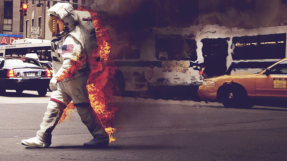 man wearing astronaut suit burning HD wallpaper