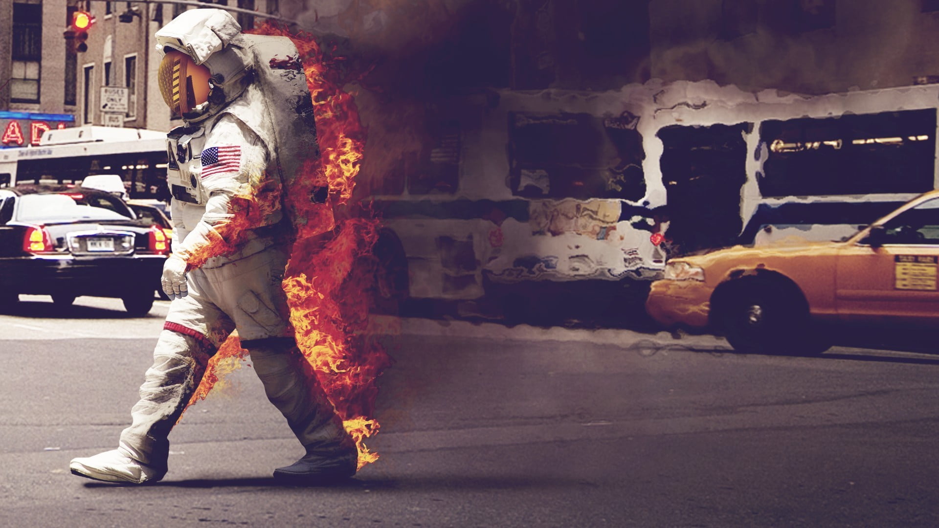 man wearing astronaut suit burning
