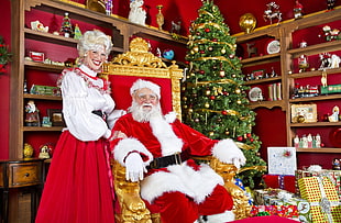 two man and women wearing Mr and Mrs Clause costume