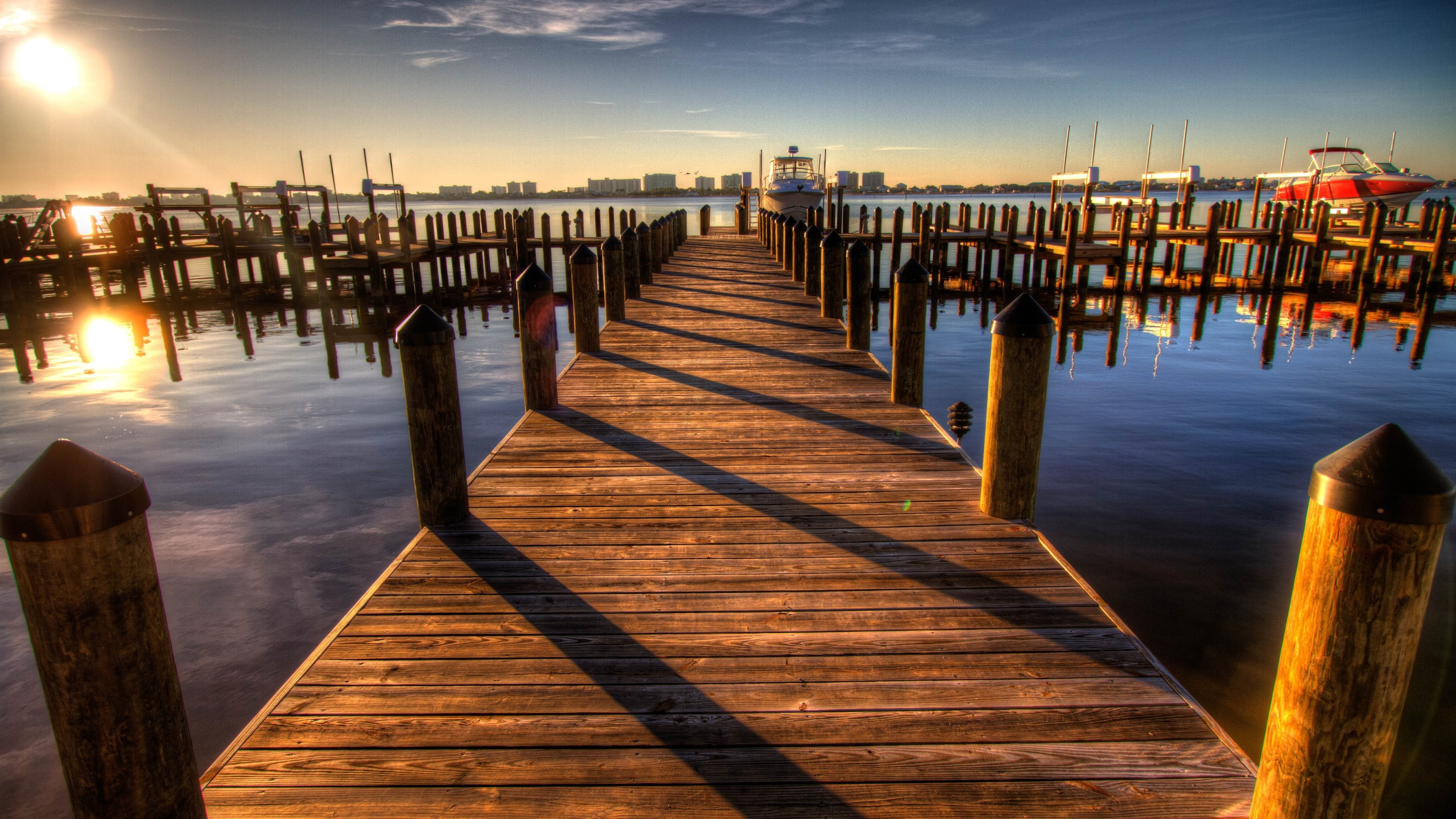 brown and black wooden bed frame, bridge, wood, sea, sky