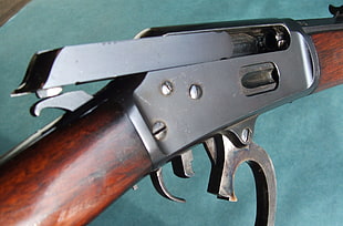 brown and black metal tool, gun, lever action rifle