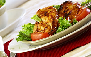 Cooked chicken with green lettuce and tomato