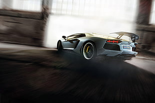 panning photography of white Lamborghini Aventador
