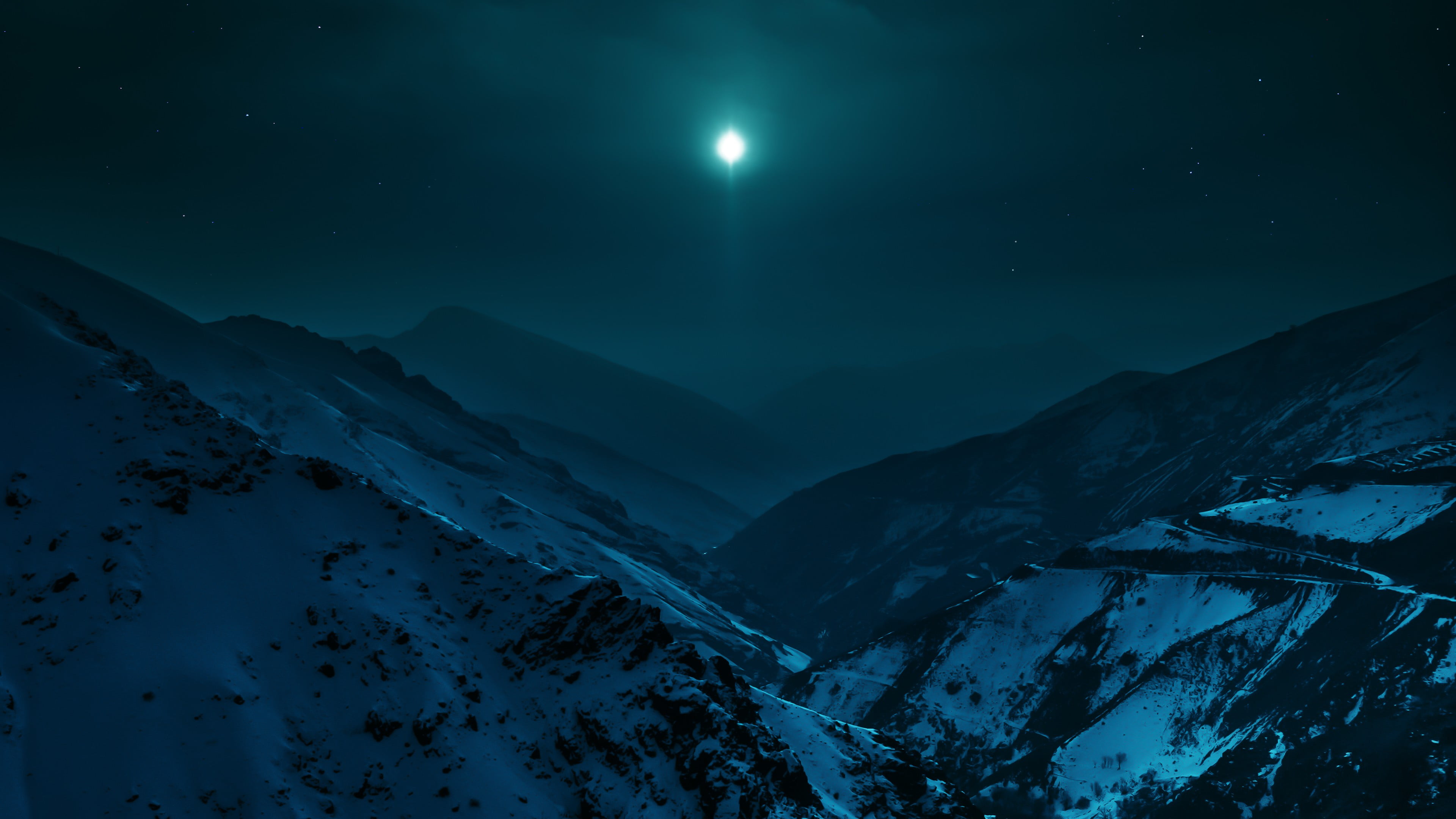 mountain range under night skies and full moon