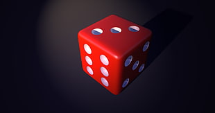 closeup photography of red dice with black background