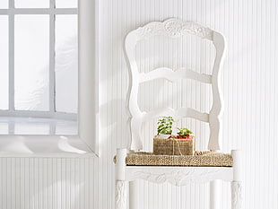 photograph of white wooden chair