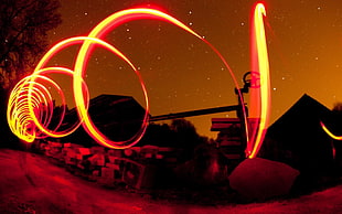 time lapse photo of red light, photography, light painting, spiral