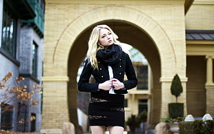 focus photo of blonde woman in black jacket