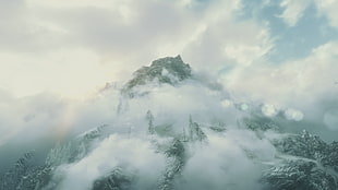 white clouds covering mountain during daytime