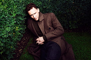 man wearing brown peacoat