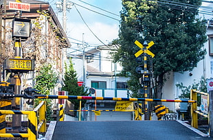yellow and black toll gate, Japan