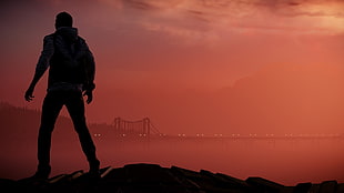 silhouette of standing man near bridge HD wallpaper