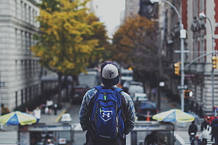 men's blue Under Armour backpack, cityscape, city