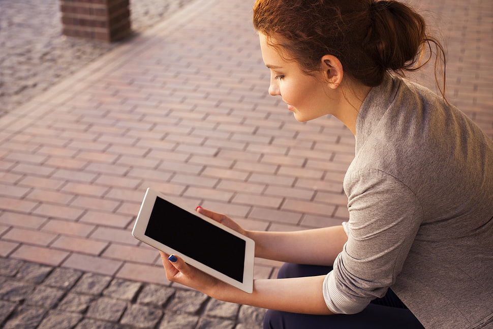 woman holding tablet computer HD wallpaper