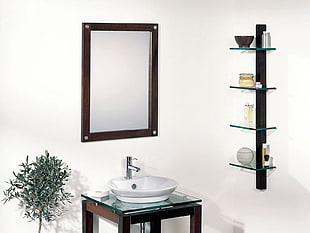 rectangular wall mirror with brown wooden frame