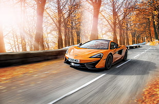 orange luxury car photo during daytime HD wallpaper