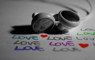 white earbuds on white love printed paper HD wallpaper
