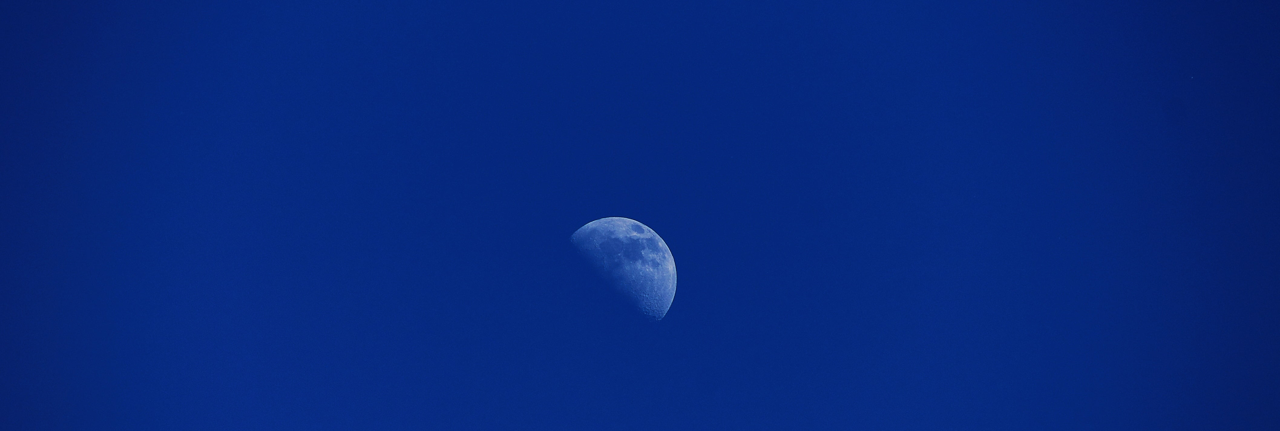 half moon during daytime