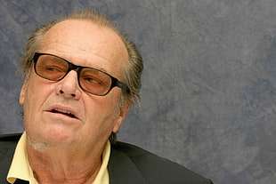 man wearing black top with black framed eyeglasses