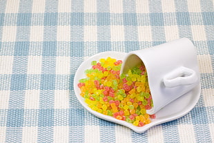 photo of candies in plate and mug