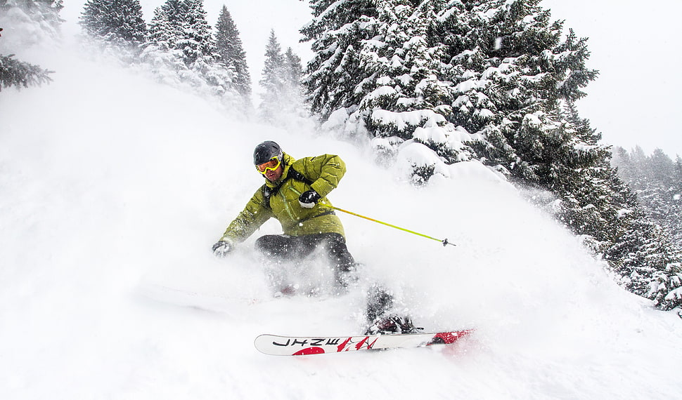 person in yellow jacket doing snowboard during daytime HD wallpaper