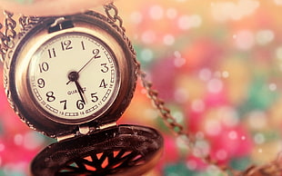 gray pocket watch at 5;219
