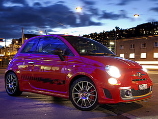 photography of red Abarth 500