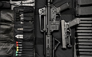 black rifle with semi-automatic pistol