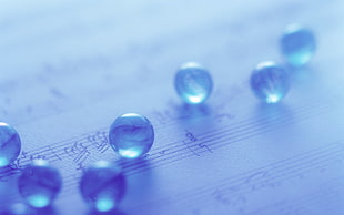 clear glass beads on musical notes